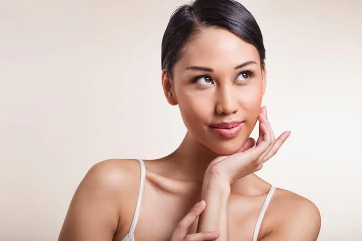 Woman resting her chin on her palm